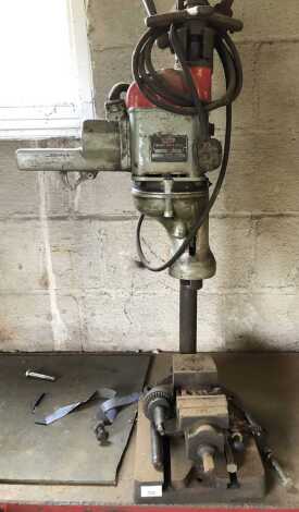 A Wolf 1" heavy duty drill press.