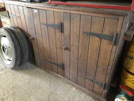 A pine workshop cupboard, three door, 105cm high, 183cm wide, 56cm deep.