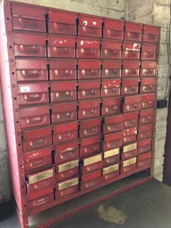 A red steel parts bin cabinet, 104cm high, 92cm wide, 33cm deep.