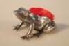An Edwardian silver pin cushion in the form of a sitting frog