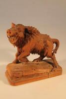 A Black Forest carved wood figure of a Wild Boar