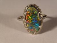 A black opal and diamond dress ring