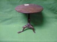 A mahogany miniature tilt top table