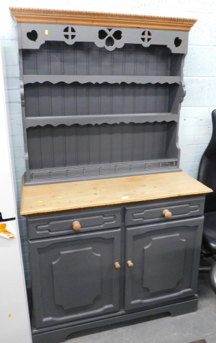 A painted pine kitchen dresser, grey painted with plate rack above arrangement of two drawers and two cupboard doors, on bracket feet.