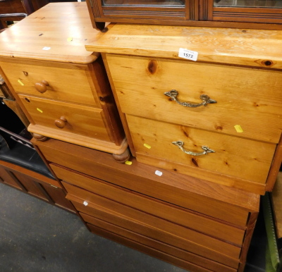 Two pine two drawer bedsides, two three drawer chests, and a walnut hanging rack. (5)