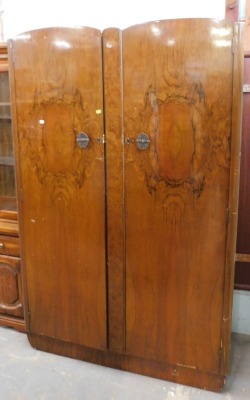 A burr walnut double wardrobe, together with a display cabinet, a headboard and a wall-mounted coat rack.