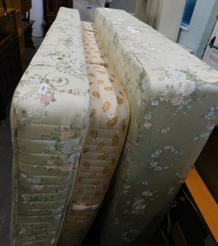 A double divan bed base mattress, additional mattress, and a teak headboard. (4) WARNING! This lot contains untested or unsafe electrical items. It is supplied for scrap or re-conditioning only. TRADE ONLY