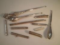 Three 20thC silver handled button hooks and other silver