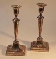 A pair of Neo-classical design plated candlesticks.