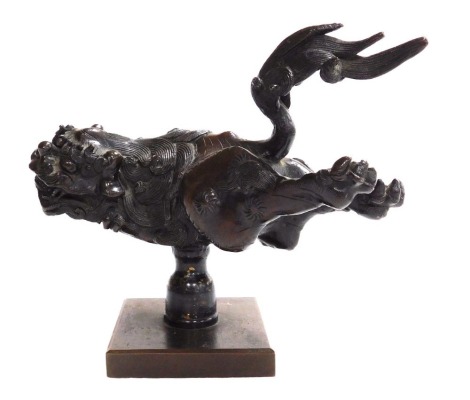 A Meiji period Japanse bronze Shi-shi, on a later pedestal mount, with square base, 12cm high.