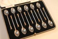 A set of Twelve George VI silver seal top coffee spoons