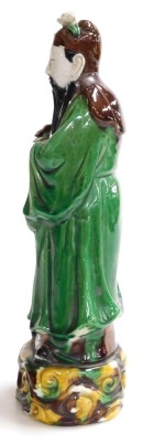 A 19thC Qing dynasty Chinese glazed figure of a scholar, 30cm high. - 2