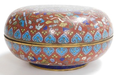 A 19thC Chinese circular compressed cloisonne enamel box, decorated with emblems of flowers and precious objects, on a red ground, the cover with central panel of butterflies and flower heads in polychrome enamels, on blue ground, 11cm high, 24cm diameter - 2