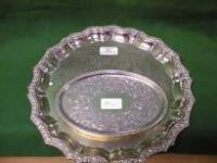 An EPNS salver, engraved to the centre, with shaped and cast raised rim,