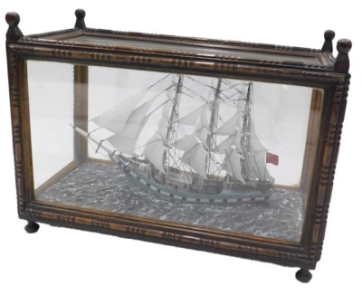 Late 19thC School. Model sailing ship Brynhilda out of Glasgow, three masted in full sail with figures on deck, approx 45cm long, in glazed case, 62cm x 31cm x 45cm.