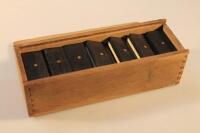 A 20thC bone dominoes set.