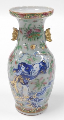 A 19thC Qing dynasty Chinese porcelain baluster vase, with a celadon glaze enriched in coloured enamels with figures at court, butterflies, flowers, etc., with moon shape lug handles, 24cm high. (AF) - 3