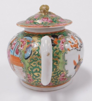 A 19thC Qing dynasty Chinese porcelain miniature teapot, in famille rose Canton style, with figures, birds and flora, the cover with gilt knop, 9cm high. - 4