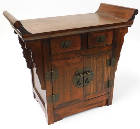 A 20thC elm table cabinet, with brass ironmongery, 45cm high, 50cm wide.