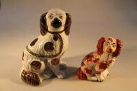 A 19thC Staffordshire Spaniel and a 20thC reproduction Spaniel.