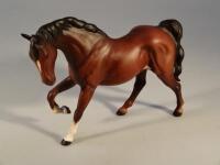 A Beswick figure of a horse in matt brown