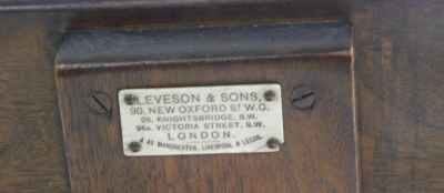 A Victorian walnut, oak and cast iron music stand, by Leveson & Sons, London, the sheet music stand on a brass adjustable arm, above a circular table, raised on a straight column and four leaf capped lion's paw feet, 112cm high. - 3