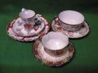 Three Japanese eggshell china cups and saucers