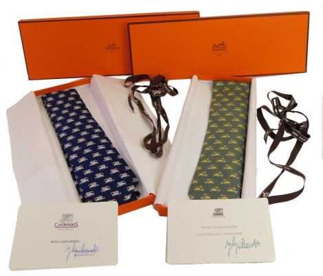 Two Hermes silk ties, each decorated with a griffin, in blue and sage green, boxed, with compliments slip from Cordenon's.