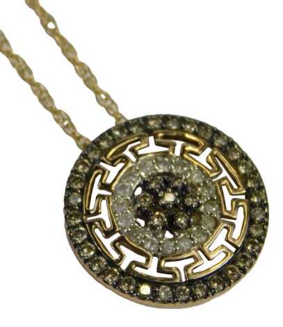 A circular pendant and chain, set with CZs, in a Greek key border, unmarked, 1.5cm high, on fine link neck chain, stamped 9kt, 44cm long, 4.3g all in.