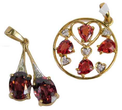 Two pendants, comprising a cherry drop pendant set with two garnets and cz stones, yellow metal, stamped 375, 2cm high, and a 9ct gold red/orange coloured stone set circular pendant, 1.5cm high, 3.4g all in. (2)