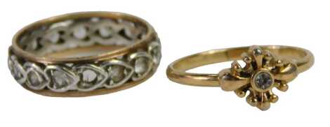 Two dress rings, comprising a cluster ring set with an imitation diamond, yellow metal unmarked, ring size N½, and a 9ct gold and silver eternity ring set with cz stones, ring size N½, 4.1g all in.