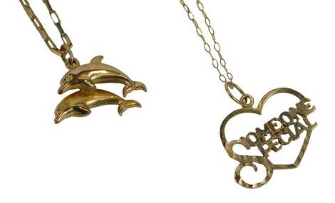 Two 9ct gold pendants and chains, comprising a double dolphin pendant on a box link neck chain, and a Someone Special pendant, on a fine link neck chain, 3.6g all in. (2)