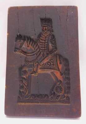 A wax biscuit mould, of rectangular form, carved with a figure on horseback, 31cm x 20cm. - 2