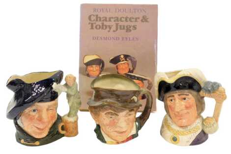 Three Royal Doulton pottery character jugs, modelled as Dick Whittington Lord Mayor of London, D6846, Paddy, and Tam O' Shanter, D6632, together with Eyles (Desmond) Royal Doulton Character and Toby Jugs, hardback with dust jacket. (4)