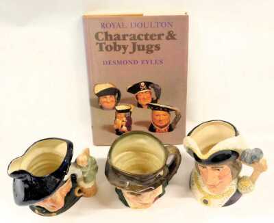 Three Royal Doulton pottery character jugs, modelled as Dick Whittington Lord Mayor of London, D6846, Paddy, and Tam O' Shanter, D6632, together with Eyles (Desmond) Royal Doulton Character and Toby Jugs, hardback with dust jacket. (4) - 2