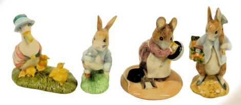 Four Beswick Beatrix Potter pottery figures, modelled as Hunca Munca, Jemima and Her Ducklings, Peter Rabbit Gardening, and Peter Rabbit, boxed.