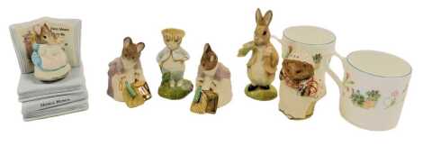 Five Beswick pottery Beatrix Potter figures, comprising Benjamin Ate a Lettuce Leaf, Hunca Munca Sweeping, Mrs Tiggy-Winkle, Tom Kitten in the Rockery, and Hunca Munca Sweeping, together with two Wedgwood Peter Rabbit porcelain mugs, 7.5cm high, and an En