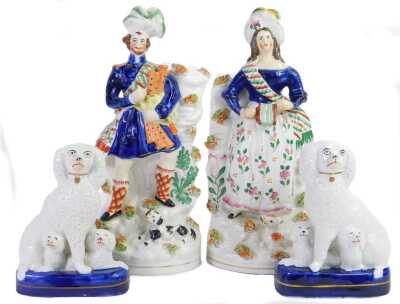 A pair of 19thC Staffordshire pottery figures, modelled as a male and female wearing Highland dress, 30cm high, (AF), together with a pair of Staffordshire Spaniel figures, 17cm high.