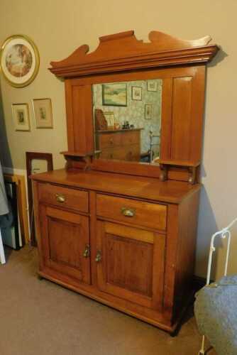 An Edwardian walnut dresser, with mirror back, 184cm high, 120cm wide, 45cm deep. This lot is located offsite. For further details and to arrange a viewing, please call The Bourne Auction Rooms on 01778 422686.