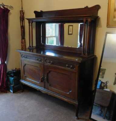 An Edwardian mahogany mirror back sideboard, with two drawers, two doors, on cabriole legs, 175cm high, 155cm wide, 56cm deep. This lot is located offsite. For further details and to arrange a viewing, please call The Bourne Auction Rooms on 01778 422686.