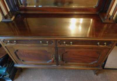 An Edwardian mahogany mirror back sideboard, with two drawers, two doors, on cabriole legs, 175cm high, 155cm wide, 56cm deep. This lot is located offsite. For further details and to arrange a viewing, please call The Bourne Auction Rooms on 01778 422686. - 2