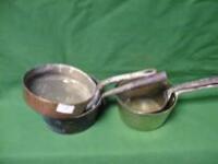 A copper skillet, and 3 brass saucepans