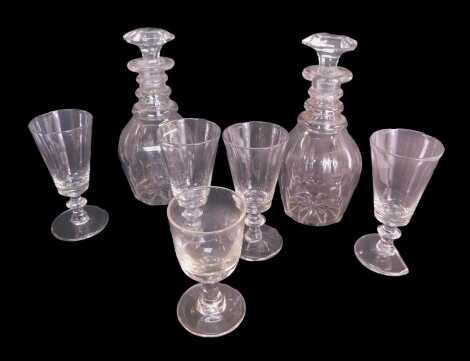 A pair of Georgian cut glass decanters and stoppers, 22cm high, together with various drinking glasses.