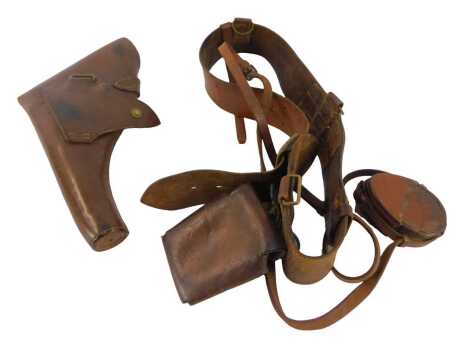 A World War I British Army leather belt, with pouch stamped 2BR, a leather compass holder named to GH Grosvenor RMC, together with a gun holster.