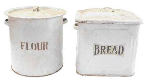 A mid 20thC white enamel bread bin, with lid, 30cm high, and a flour bin, of round form, with lid. (2)