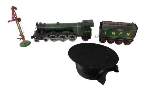 A tinplate O gauge model of The Flying Scotsman, with tender, 60cm long overall, together with a British Railways hat, and a Hornby tinplate signal, 26cm high, (3)