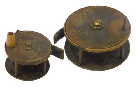 A Fosters of Ashbourne 2" plate wind brass centre pie reel, and another. (2)