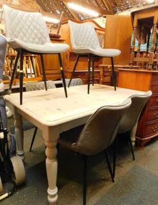 A contemporary pine extending dining table, the rectangular top with a rounded edge, on painted grey turned legs, 77cm high, the top 139cm x 89cm, together with a set of six Woltu grey faux leather upholstered dining chairs.