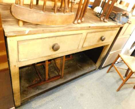 An early 20thC pine workbench, the rectangular top above a base with two frieze drawers, with under tier, 87cm high, 134cm wide, 55cm deep, together with a Record 3½" vice.