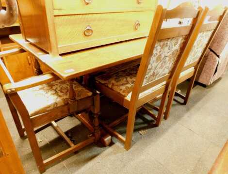 An oak Old Charm style refectory type dining table, the rectangular top on trestle base, 74cm high, the top 82cm x 176cm, together with five dining chairs, including one carver. The upholstery in this lot does not comply with the 1988 (Fire & Fire Furnish